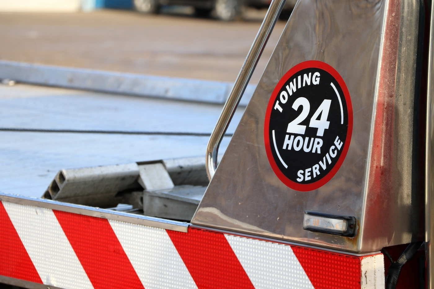Parking lot sign warning that unauthorized vehicles will be towed at owner's expense